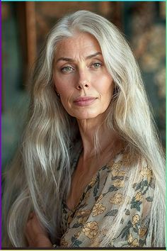 an older woman with long white hair posing for a photo