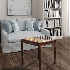 a living room with a couch, coffee table and chess board on the wooden floor