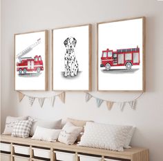 three pictures of dogs and firetrucks hanging on the wall in a room