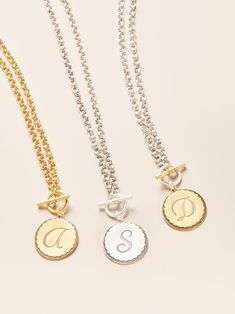 A bolder way to wear your initial~ The Front toggle closure and hand-antiqued double cable chain add an artisan vibe to a classic piece. The initial coins are hand-pressed in a New England jewelry factory that has been making them since the original heyday of sororities in the 1950’s, hence the name. John rediscovered them over ten years ago, and they have since become our signature design, featured on Oprah’s O List and worn by thousands of fans nation-wide. Product Details: Gold and Silver pla Classic Round Disc Jewelry With Initials, Classic Monogram Medallion Jewelry, Silver Toggle Necklace With Coin Pendant As Gift, Personalized Vintage Jewelry For Everyday, Everyday Personalized Vintage Jewelry, Engraved Initial Coin Necklace, Medallion Toggle Necklace With Coin Pendant As Gift, Silver Medallion Jewelry With Toggle Clasp, Vintage Monogram Necklaces With Initial Pendant