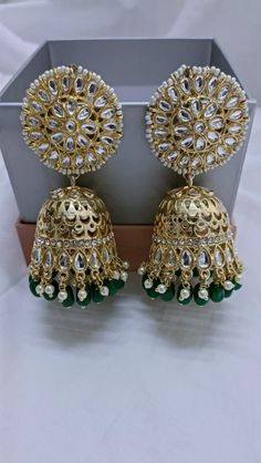 Golden Kundan Jhumka/ Sabyasachi Kundan Earring/ Indian Punjabi Jhumka/ Kundan Pearl Jhumka/ Wedding Earrings/ Bridesmaid Kundan Jhumka We bring you casual as well as party wear jewelry which comes with an attractive design and helps in boosting your style factor. A classic fusion of exquisite craftsmanship and elegance, this jewelry tries to make you look graceful and stylish when paired with your attire. It goes well with modern and traditional outfits.  These Earrings are made of Alloy, Pure Copper and Kundan and Pearls . Trust me the quality of Earrings is the Best  Women love jewelry; specially traditional jewelry adore a women. They wear it on different occasion. They have special importance on ring ceremony, wedding and festive time. They can also wear it on regular basics. Make you Punjabi Jhumka, Kundan Jhumka, Earring Indian, Ring Ceremony, Rings Ceremony, Valentine Gifts For Girlfriend, Earrings Bridesmaid, Kundan Earrings, Kundan Jewellery