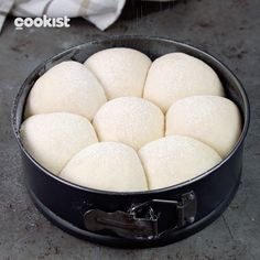 a pan filled with dough on top of a counter