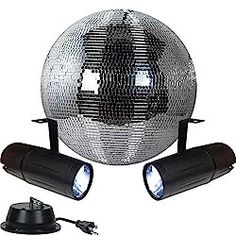 a disco ball with two spotlights and one light on the ground next to it