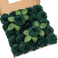 a cardboard box filled with lots of green flowers