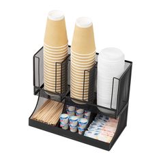 two cups are stacked on top of each other in a holder that holds plates and condiments