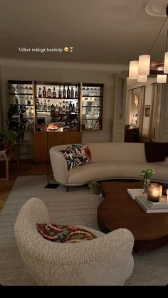 a living room filled with furniture and candles