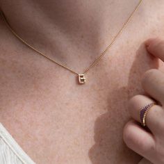 "The personalized initial necklace with baguette diamonds will add a sweet and shimmering note to your individual style! Materials: 18k solid gold | baguette cut diamonds Available letters: A, B, C, D, E, F, G, H, I, J, K, L, M, N, O, P, Q, R, S, T, U, V, W, X, Y, Z Chain with a gold clasp: 40 cm/15.748\" Available in YELLOW, WHITE or ROSE 18k gold. Information about Our White Gold: We do not add rhodium plating to our gold items; the natural color of the white gold is retained. As a result, the Elegant Everyday Initial Necklace With Square Pendant, Elegant Square Pendant Initial Necklace For Everyday, Elegant Initial Pendant Necklace With Letter Beads, Elegant Everyday Necklace With Letter Beads, Elegant Everyday Letter Beads Necklace, Everyday Yellow Gold Initial Necklace With Diamond, Elegant Yellow Gold Initial Necklace With Square Pendant, Elegant Yellow Gold Square Pendant Initial Necklace, Gold Items