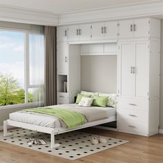 a white bed with green pillows in a room