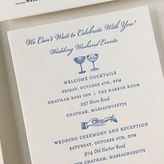 the wedding stationery is laid out on top of each other