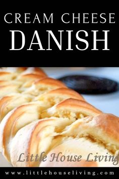 a close up of bread on a plate with the words cream cheese danish in front of it