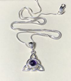 Did you enjoy Charmed, the TV show? I'll fabricate this sterling silver Celtic Trinity Knot pendant, approximately 1 inch in diameter, and I will set your choice of a 6mm round faceted or cabochon gemstone from the drop down menu. This comes with a 16 inch sterling silver box chain at 1.2mm thickness with a lobster claw for secure attachment. This is shown with a classic green Lab emerald faceted gemstone for the lucky lass in you! It's lovely, graceful and elegant...a timeless and classic tradi Silver Spiritual Necklace With Birthstone, Silver Spiritual Birthstone Necklace, Spiritual Silver Birthstone Necklace, Purple Sterling Silver Spiritual Necklaces, Spiritual Sterling Silver Necklace With Round Stone, Sterling Silver Birthstone Necklace With Natural Stones, Sterling Silver Round Birthstone Necklace With Natural Stones, Sterling Silver Birthstone Necklaces For Healing, Healing Sterling Silver Birthstone Necklace