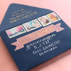 a blue envelope with stamps on it and a pink ribbon around the bottom that says, left reich