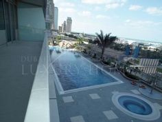 an empty swimming pool on top of a building