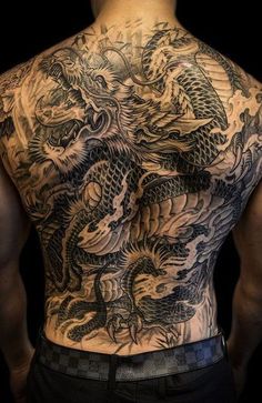 a man with a dragon tattoo on his back