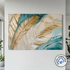 a painting hanging on the wall next to a potted plant in a living room