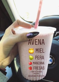 a woman holding up a cup with a pink straw in it's hand and the words, avena mel pera mana