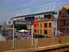 an outdoor baseball game is being played in the city