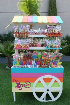 an ice cream cart filled with lots of candy