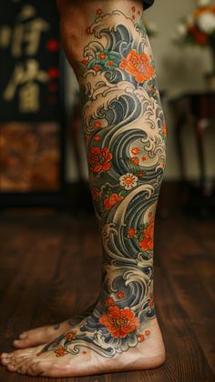 a person with tattoos on their legs is standing in front of a wall and wooden floor