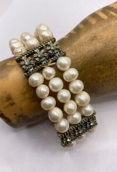 This is a lovely beaded stretch bracelet with a center plates  Perfect for bride, wedding, maid of honor gift.  This bracelet consists of fresh water pearls View our stretch bracelets in a variety of real stone beads, each genuine friendship bracelet will be a pleasure to own, to gift or for couples to share: https://www.etsy.com/shop/EastVillageBangles?section_id=38654054 East Village Bangles is the product of love ❤️, a unique collection of vintage jewelry painstakingly restored by Casey in the East Village. Even as we put love, sweat (and sometimes tears!) into restoring these items, it is our policy that you must be thrilled. We stand behind every item and we will take it back if it is not for you. Elegant Stretch Bracelet With Pearl Charm And Round Beads, Beaded Pearl Bracelet For Anniversary, Formal Adjustable Beaded Pearl Bracelet, Adjustable Pearl Bracelet For Formal Events, Adjustable Pearl White Beaded Bracelet For Anniversary, Elegant Stackable Pearl Bracelet For Wedding, Elegant Adjustable Stretch Bracelet For Anniversary, White Pearl Bracelet With Extender For Wedding, Elegant Pearl White Stretch Bracelet As A Gift