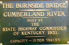 the sign for the burnside bridge, cumberland river built by the state highway commission of kentucky