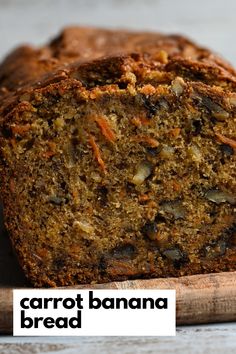 a loaf of carrot banana bread sitting on top of a wooden cutting board