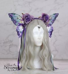 A real must-have statement crown for all fairies! A beautiful purple rose flower fairy headdress. The wings are lightweight and far more durable than their glassy appearance might suggest! They are backed with wire, which is what gives them their gorgeous curve. They are flexible to touch, and may be very slightly adjusted to give a deeper/more shallow curve. The headdress is decorated with purple roses and blossoms. Sparkling Swarovski beads and butterfly charm hang over the forehead from a sil Butterfly Flower Crown, Adult Fairy Costume, Wing Butterfly, Festival Headpiece, Cute Hair Colors, Fairycore Fairy, Purple Decor, Swarovski Beads, Butterfly Flower