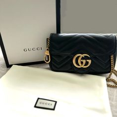 Gucci Gg Marmont Flap Bag Matelasse Leather Super Mini Accessories: Key Ring, With Strap Measurements: Handle Drop 4", Height 4", Width 6.5", Depth 2", Strap Drop 24" Model: Gg Marmont Flap Bag Matelasse Leather Super Mini Exterior Material: Leather Exterior Color: Black Interior Material: Microfiber, Satin Interior Color: Neutral Hardware Color: Gold Mini Accessories, Gucci Gg Marmont, Gg Marmont, Interior Color, Gucci Bags, Flap Bag, Black Interior, Colorful Interiors, Key Ring