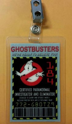 a ghostbuster id badge is attached to a door