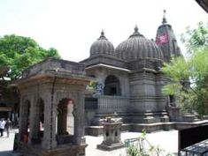 an ornate building with two towers and pillars