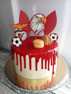 a cake decorated with an eagle and soccer balls