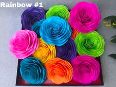 there are many different colors of paper flowers