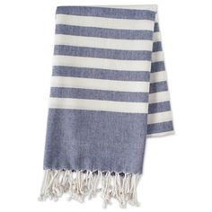 a blue and white striped towel with tassels