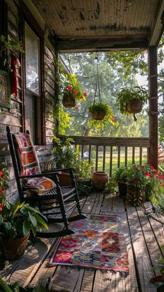 Tranquil porch with greenery, flowers, hanging baskets, and potted plants soaking in sunlight, perfect for relaxation.