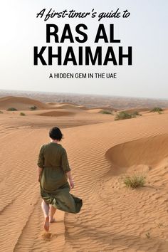 a person walking in the desert with text overlay that reads, an adventurer's guide to ras al khamah