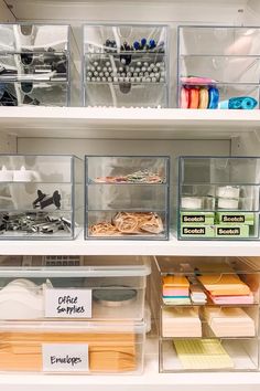 the shelves are organized with clear bins and plastic containers for crafting, or sewing