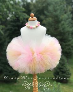 "Pink, Gold and Ivory Fluffy Girls Tutu. This girls tutu is super fluffy. I use 12 layers of tulle to make it super full and fluffy. Colors used: Pink, Gold and Ivory. TUTU SIZES: (measure waist to make sure) Preemie-12\" waist 4.0\" Length Newborn-13\" waist 4\"Length 3-6 mos-14-17\" waist 5\" length 6-12 mos-18-19\" waist 7\" length 18-24 mos-20-21\" waist 7\" length 2T/3T- 21-22\" waist 7\" length 4-5 girls-22-23\" waist 8\" length 6-8 girls-23-24\" waist 8\"length 8-10 girls- 24-25\" waist 9 High Chair Tutu, Infant Tutu, First Birthday Tutu, Measure Waist, Birthday Highchair, Newborn Photo Shoot, Rainbow Tutu, Toddler Tutu