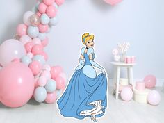 a princess in blue dress standing next to pink and white balloons