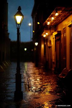 a street light on a rainy night in the city