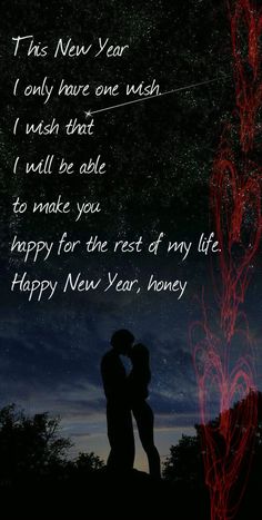 a couple kissing in front of a night sky with the words happy new year written on it