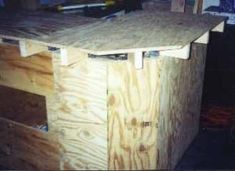 a workbench made out of plywood and wood