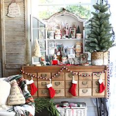 a living room filled with furniture and christmas decorations