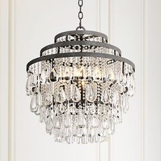 a chandelier hanging from the ceiling in a room