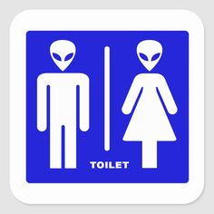 a blue and white sign with an alien man and woman in the bathroom next to each other