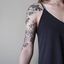 a woman with a tattoo on her arm