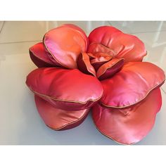 a large flower made out of pink leather