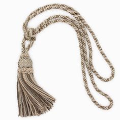 a rope with a tassel hanging from it's end on a white background