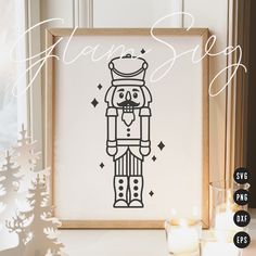 a framed photo with a drawing of a nutcracker in front of some candles