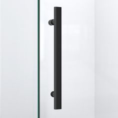 an open door with a black handle on the front and back doors, in a white room