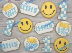 decorated cookies are arranged in the shape of smiley face and one is for each child's first birthday